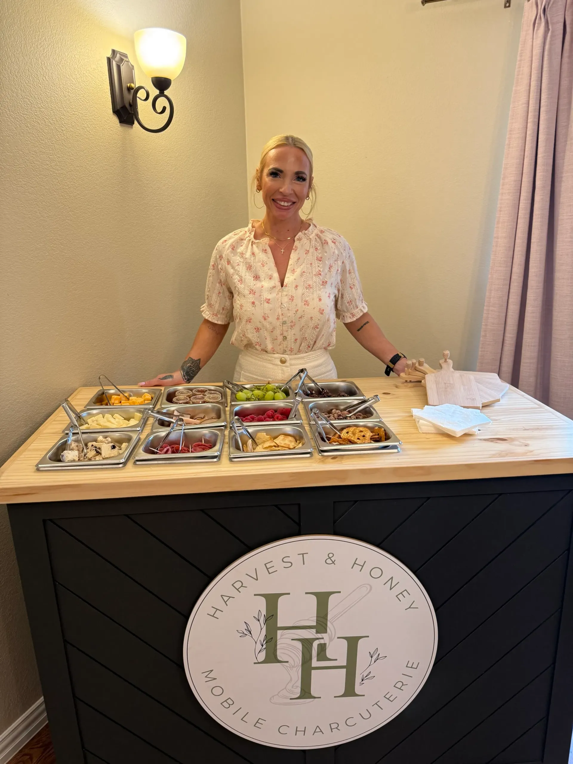 The owner standing behind the branded Harvest and Honey cart